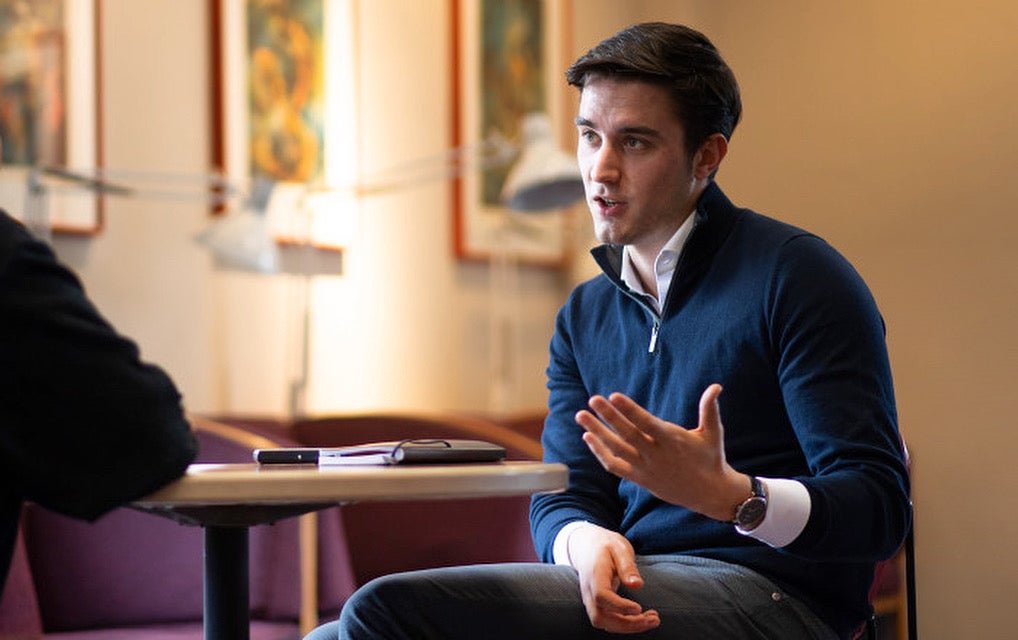 Man giving an interview while sitting down