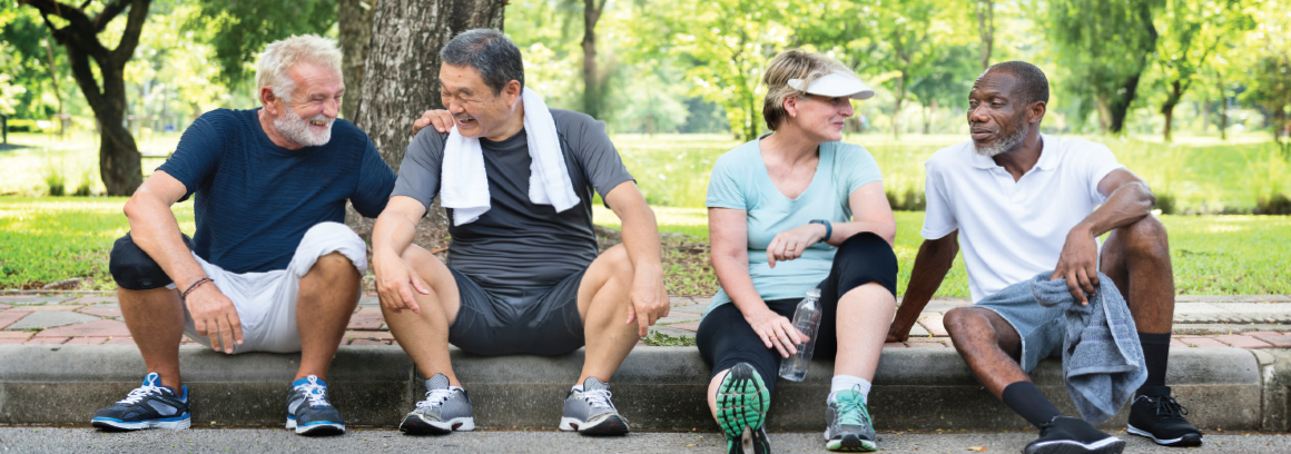 Four aging mid-life Americans sit on curb in their workout clothes