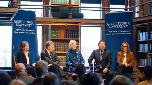 Four global leaders attend an event at Georgetown University on the Doomsday Clock