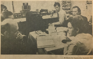 An archived clipping from 'The Washington Post' of Lois Vines (G'73), right, as she becomes the first person in the world to defend her dissertation on French literature via radio