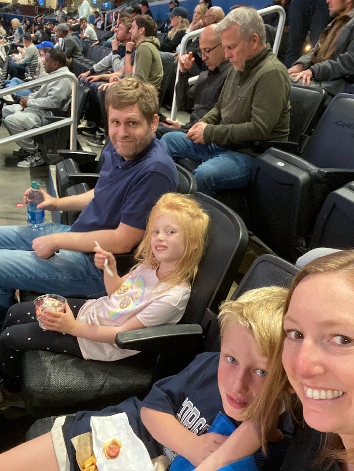 Dave and Alison DeBoer with their two kids at a Georgetown basketball game