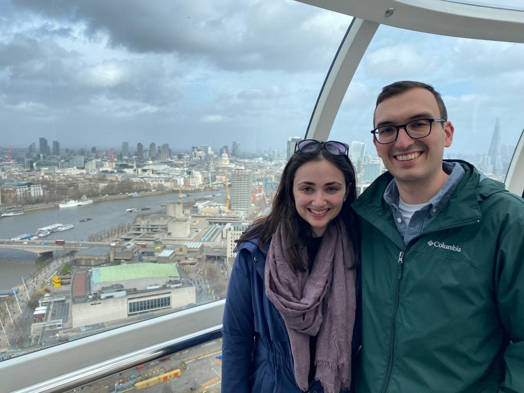 Gabby Deutsch and Nick DeMayo stand side-by-side at the top of the Seattle Needle