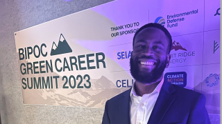 Langston Swofford (G&#039;24) headshot in front of a step-and-repeat banner reading Bipoc Green Career Summit 2023