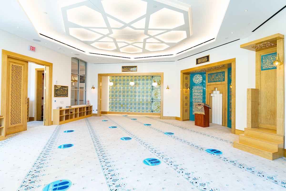 Inside the Yarrow Mamout Masjid the walls are lined with decorative gold and teal blue decor