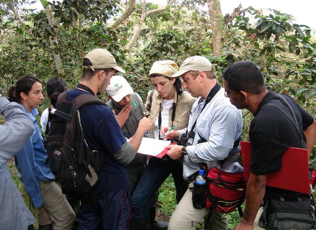 Dean Marra and student researchers in the field