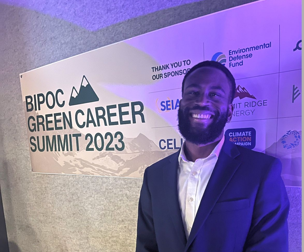 Langston Swofford (G'24) headshot in front of a step-and-repeat banner reading Bipoc Green Career Summit 2023