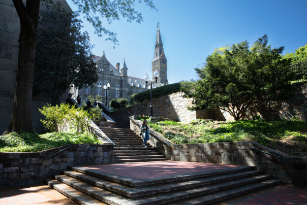 Looking up at Launinger Library and Healy Hall from 37th Street in spring