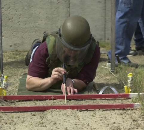 Rutherford during landmine clearing training (with dummy mines); Ft. Leonard Wood, MO (2001)