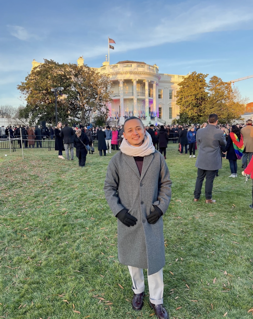 César Salgado Portillo stands in front of the White House at an LGBTQ event