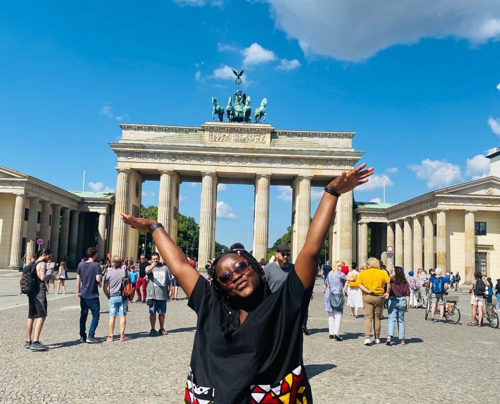Abigail Obafemi poses outside the Brandenburg Gate in Berlin, Germany.