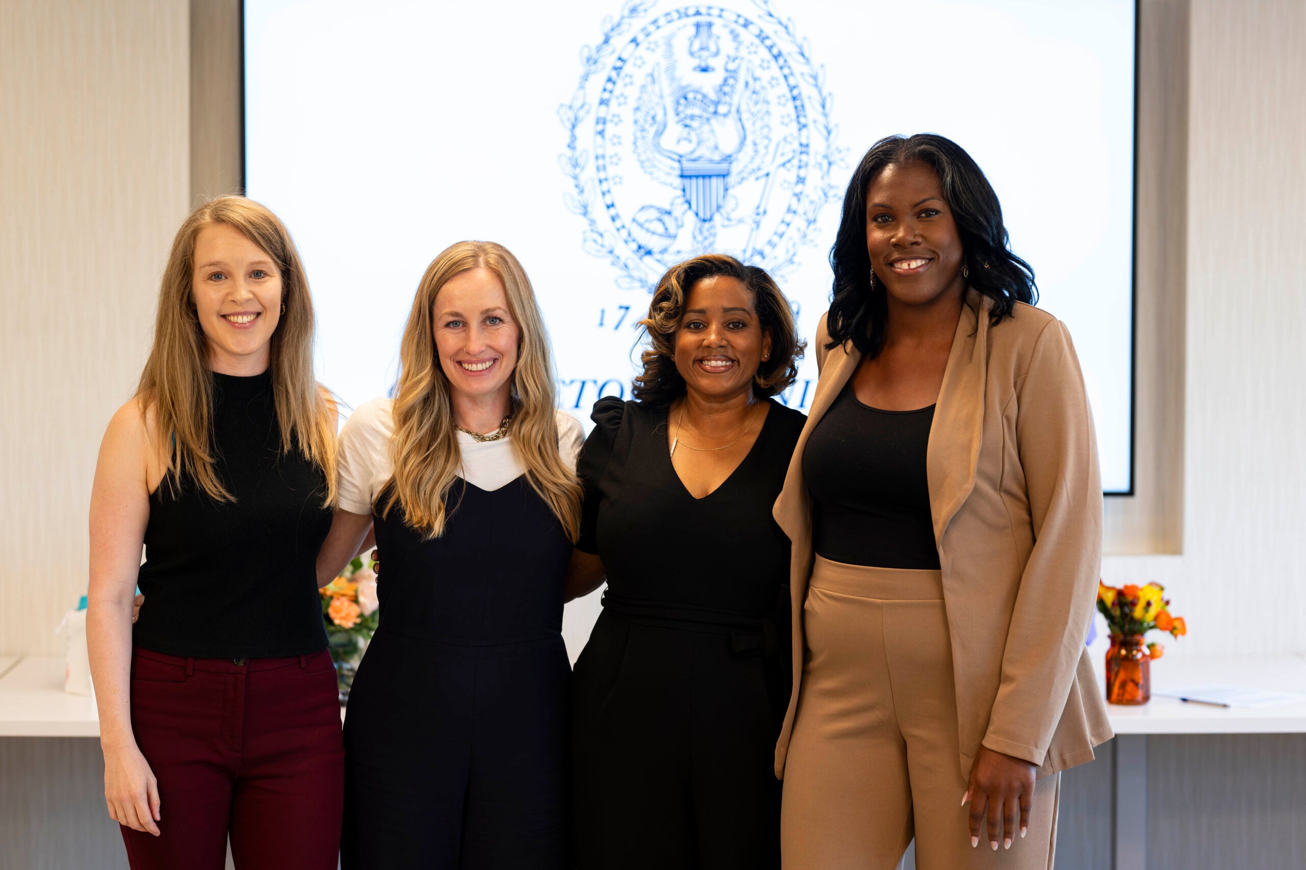 Four students in the Ph.D. in Nursing program stand for a group photo.