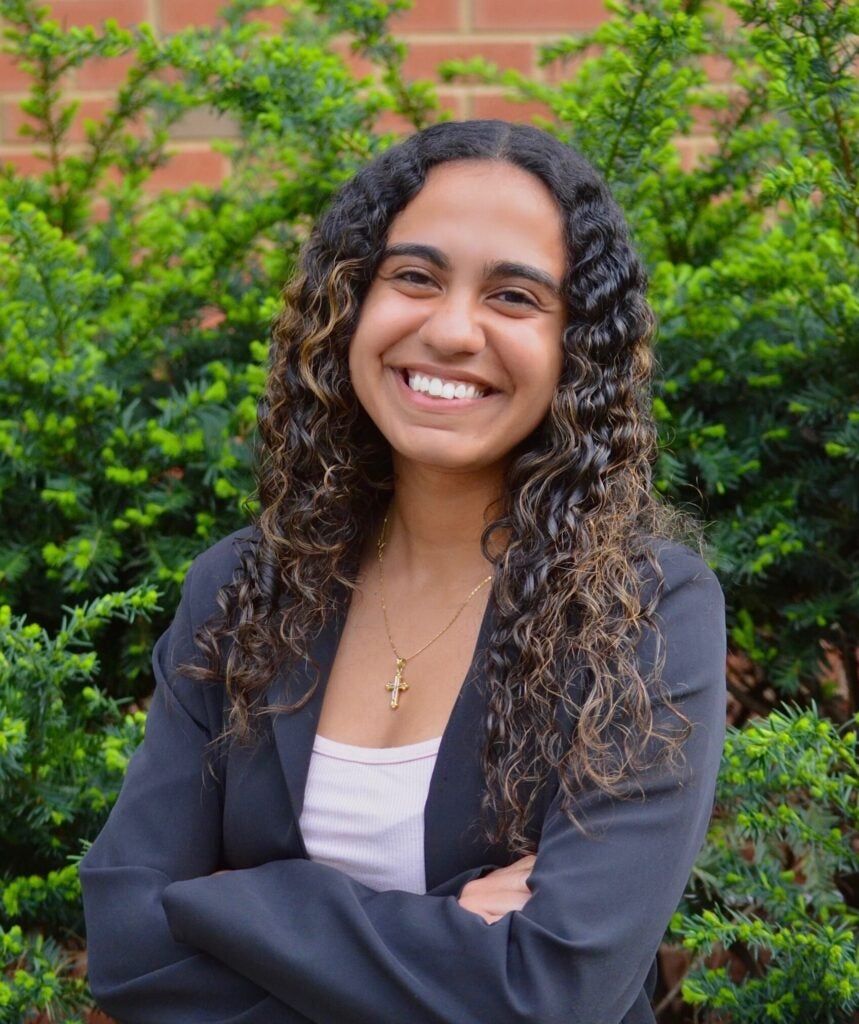 A headshot of Kenzie Mounir.
