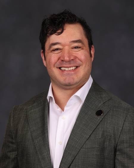 A headshot of Dax Deases.