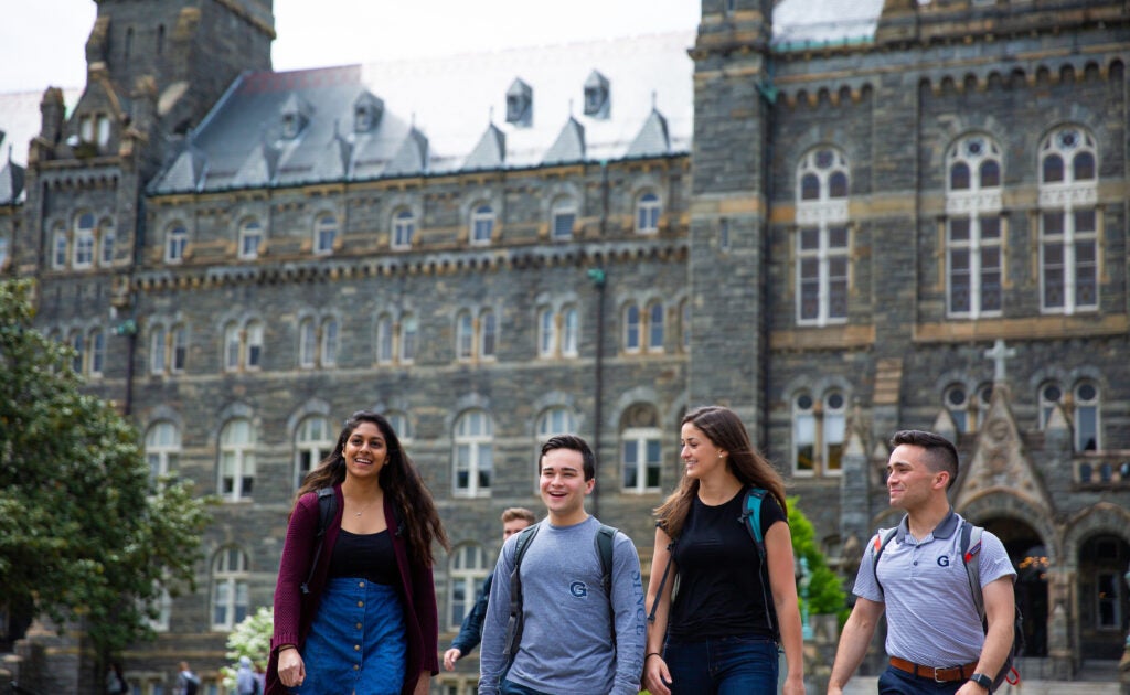 Undergrad students stroll outside Healy Hall.