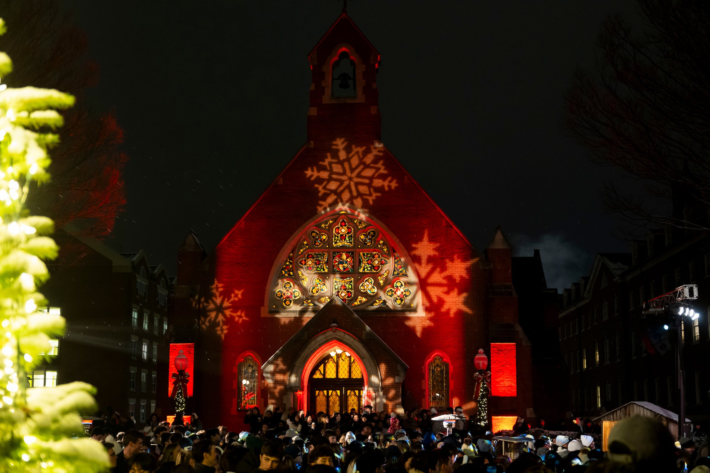 Dahlgren Chapel, seen in the evening, lights up with snowflake projections during Georgetown's Christmas Tree Lighting.