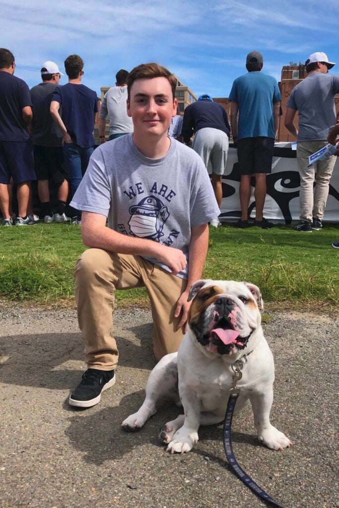 Georgetown graduate student Nicholas Riccio poses with Jack the Bulldog.