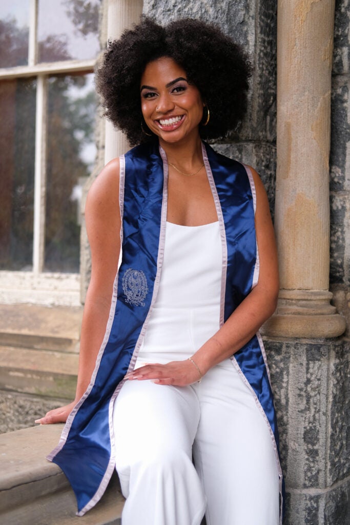 Georgetown grad student Olivia Cooley wears her undergraduate graduation stole.