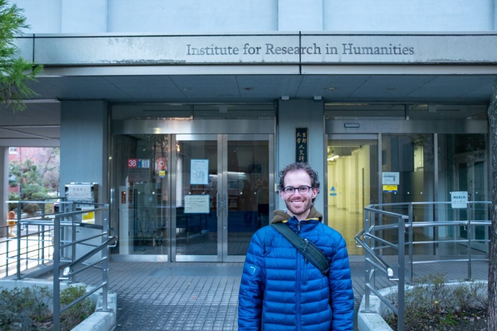 Ethan Barkalow (G'28) stands outside the Institute for Research in Humanities at Kyoto University, his host institution for the Fulbright grant.